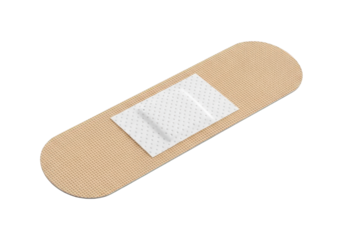 Adhesive bandage featuring a protective absorbent pad lies isolated against a dark background