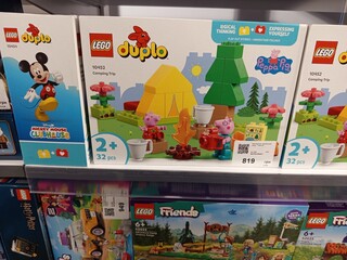 Fototapeta premium Zvyagel, Ukraine - November 20, 2025: LEGO Duplo Peppa Pig Camping Trip set displayed on store shelf, featuring colorful pieces and engaging design for young childrens playtime