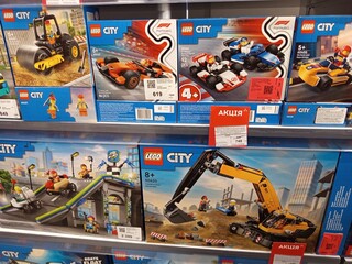 Obraz premium Zvyagel, Ukraine - November 20, 2025: LEGO City building sets displayed on store shelf, featuring various vehicles and construction themes, perfect for imaginative play and creativity
