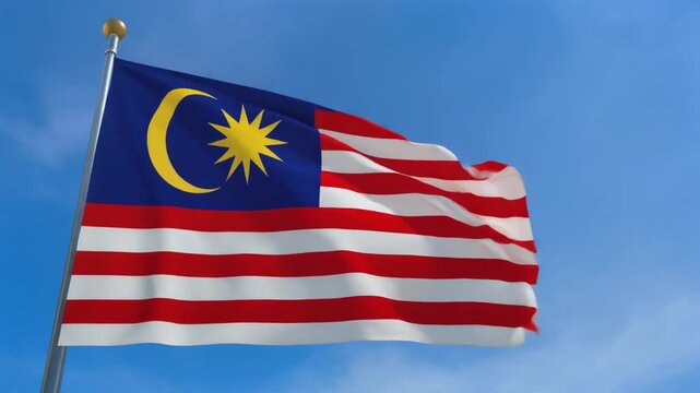 Malaysian Flag Jalur Gemilang Flying Against Clear Blue Sky