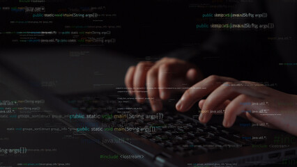 Close-up view of hands typing on a laptop keyboard with coding elements overlay, illustrating the connection between programming tasks and digital technology in modern work. Xenic