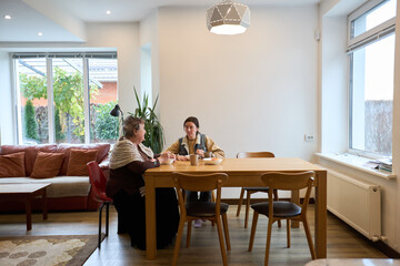 Cozy modern dining room scene with family interaction