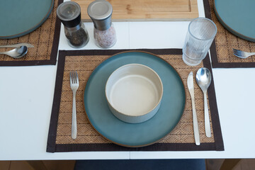Cozy table setting with ceramic dinnerware and calm morning ambiance, capturing a peaceful dining mood.