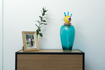 Bright kitchen cupboard with mugs and glassware neatly displayed, creating a clean and homely ambiance