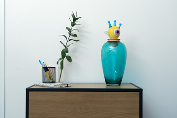 Clean kitchen shelf with a mix of mugs and textured glassware, evoking a tidy, welcoming home feeling.