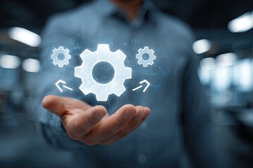 A person holds a holographic image of gears