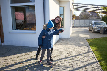 Mother and son enjoy a sunny day outdoors