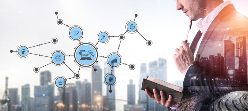 A businessman holds an open book while contemplating data connections against a modern city skyline. This image captures the fusion of knowledge and technology in business. Tessel