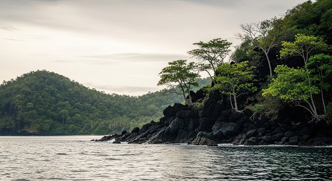 Tranquil seascape featuring a rugged, rocky shore covered with vibrant green jungle foliage against a soft, cloudy sky, reflecting a peaceful and untouched natural environment - Powered by Adobe