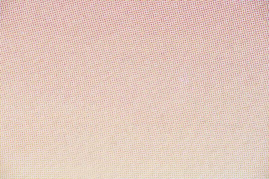 Close-Up of Halftone Dot Pattern on Faded Paper