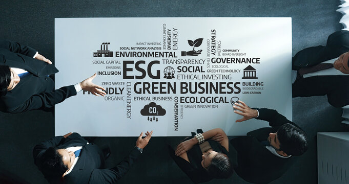 A diverse team collaborates around a table, focusing on green business strategies and ESG principles, emphasizing transparency and ethical practices for sustainable growth. Amity - Powered by Adobe