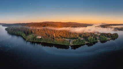Frymburk on the shore of the Lipno dam at sunset from above