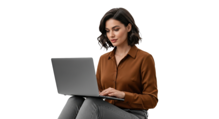 Focused professional woman using laptop for remote work and productivity in modern attire with a neutral expression