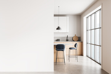Modern kitchen interior with large blank wall for poster mockup or design layout in bright minimalist apartment with natural light and clean space. 3D Rendering