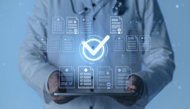 Digital medical document validation concept with doctor using tablet and checkmark symbol on blue background representing healthcare data approval process.
