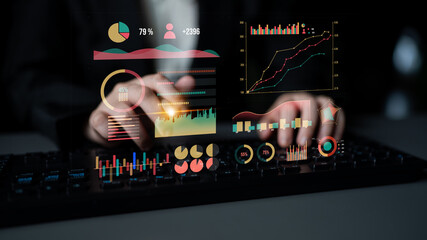 A business professional uses advanced technology to analyze data, highlighted by vibrant digital graphs and charts, illustrating insights in a sleek modern environment. Impute