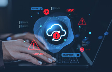 Cloud storage error alert concept with digital warning icons and hands typing on laptop in a creative cybersecurity environment on dark background.