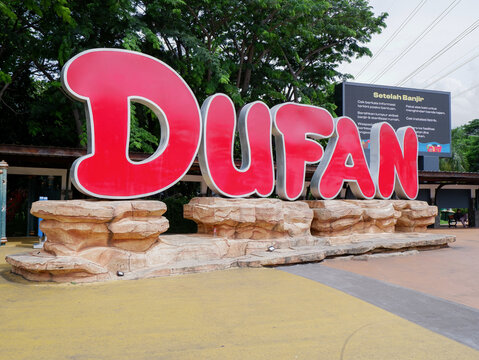 Large red Dufan signage at Dunia Fantasi theme park entrance in Ancol, Jakarta, Indonesia. Iconic amusement park landmark.
