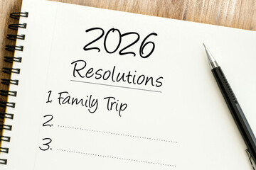 Planning for a productive year ahead a notebook open to 2026 Resolutions with a key family goal already listed, symbolizing future aspirations and personal growth