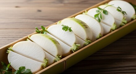 Elegant presentation of sliced white radish with garnish in bamboo tray