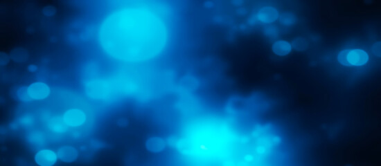 Abstract glowing blue bokeh lights on a dark background