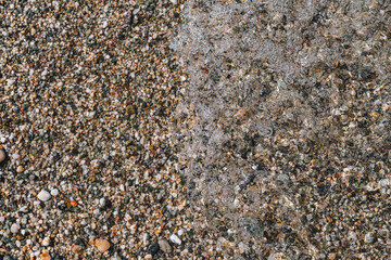 close-up of ocean waves crashing onto a pebble beach