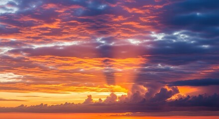 Vibrant Sunset Sky with Dramatic Golden and Purple Clouds and Sun Rays