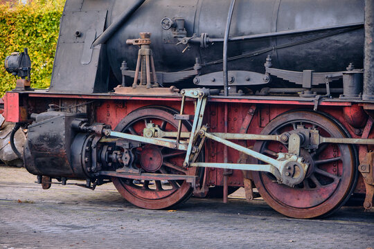 Steam locomotive wheels and mechanics at heritage railway the Museumbuurtspoorweg Haaksbergen-Boekelo railway museum open day in Haaksbergen Netherlands.