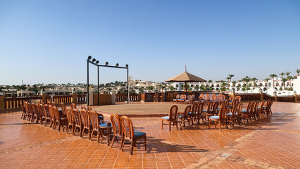 open stage for performers with rows of chairs at a hotel in Egypt.