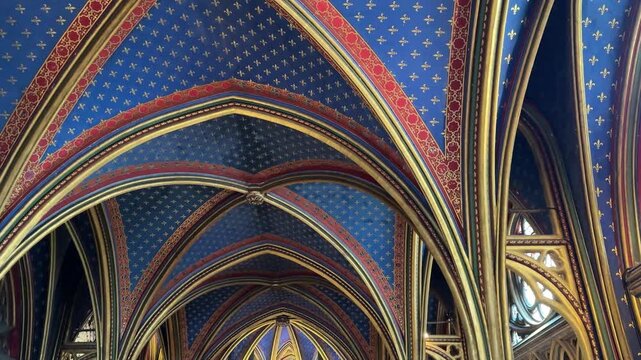 Interior details of Sainte-Chapelle in Paris, France, featuring stained glass windows and Gothic architecture, ideal for travel, history, and European heritage footage.