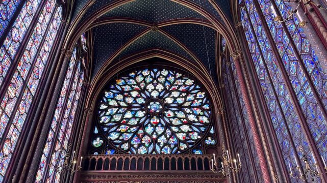 Interior details of Sainte-Chapelle in Paris, France, featuring stained glass windows and Gothic architecture, ideal for travel, history, and European heritage footage.
