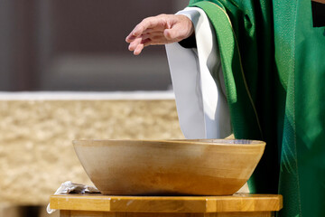 Saint Agatha Church.Baptism ceremony.Blessing of the baptismal water. Rumilly. France.