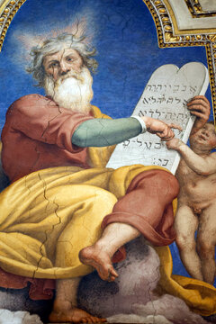 Santa Maria Maggiore Basilica.  Moses presents the Ten Commandments tablets, pointing to Hebrew text, with cherub assisting beside him.