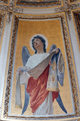 San Clemente Basilica.  Devotional angel figure in rich neoclassical setting, drapery and haloes gleaming.