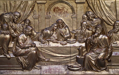 Basilica Santa Maria in Montesanto. Gilded relief of the Last Supper: Christ with Apostles at table, chalice and bread foregrounded.