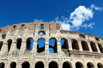 Exterior view shows massive elliptical structure of the Colosseum, largest ancient amphitheatre worldwide.