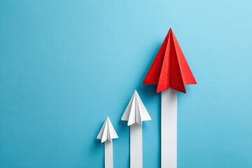 Three paper airplanes on a light blue background in a upward trend