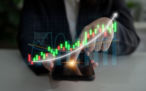 Business professional engaged in financial analysis using a smartphone, with a digital growth chart overlay representing successful investment strategies in a modern setting. Impute