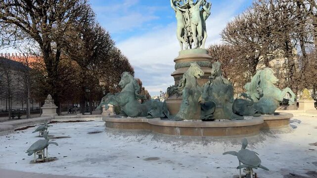 Fountain with sculptures in Jardin du Luxembourg, Paris, France, featuring flowing water and artistic statues, ideal for travel, culture, and European heritage footage.