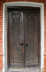 Close up of Old Brown Door with carved Designs in Tbilisi, Georgia