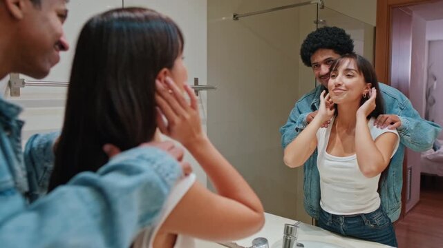 Couple in Bathroom Mirror Hugging