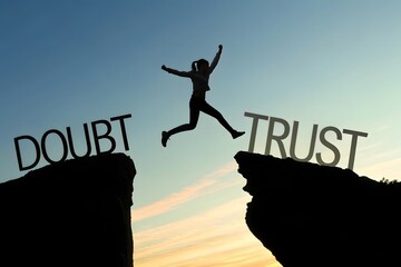 A silhouette man jumping from doubt to trust representing confidence courage decision making motivation. Growth and overcoming. Business leadership and self improvement.
