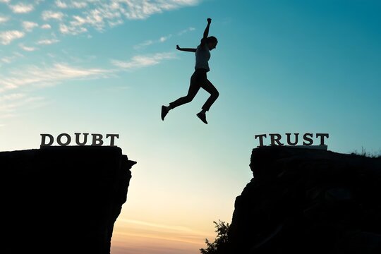 A silhouette man jumping from doubt to trust representing confidence courage decision making motivation. Growth and overcoming. Business leadership and self improvement. - Powered by Adobe