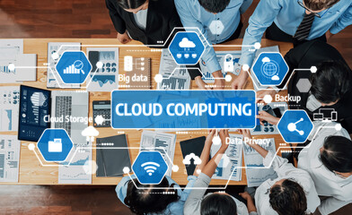 A diverse team engages in collaborative discussions around cloud computing strategies, leveraging modern technology for enhanced data management and business effectiveness. Amity