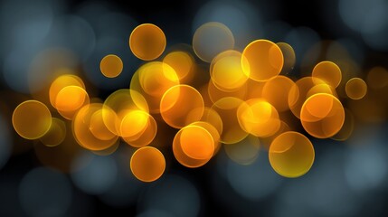 Abstract glowing circles in warm yellow and orange hues on a blurred dark background creating a festive and vibrant atmosphere for digital art and design