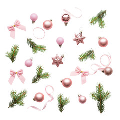 Soft pink christmas ornaments and pine sprigs scattered on white background
