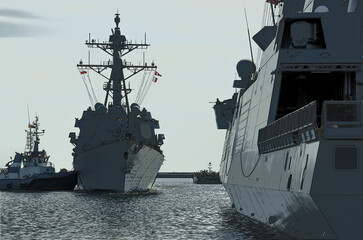 GUIDED MISSILE DESTROYER - US Navy ship maneuvers in the port assisted by a tugboat  © Wojciech Wrzesień
