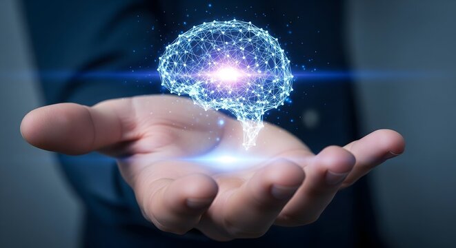 Close-up of a person's hand holding a bright, glowing digital brain model composed of a polygonal mesh and network connections, symbolizing artificial intelligence and innovation