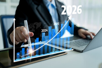 A professional businessman showcasing a growth chart that spans from 2023 to 2026, accompanied by a laptop and tablet, ideal for business and finance themes. Tessel