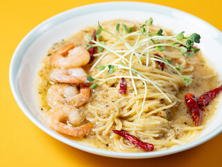 Oil pasta with shrimp on a plate
